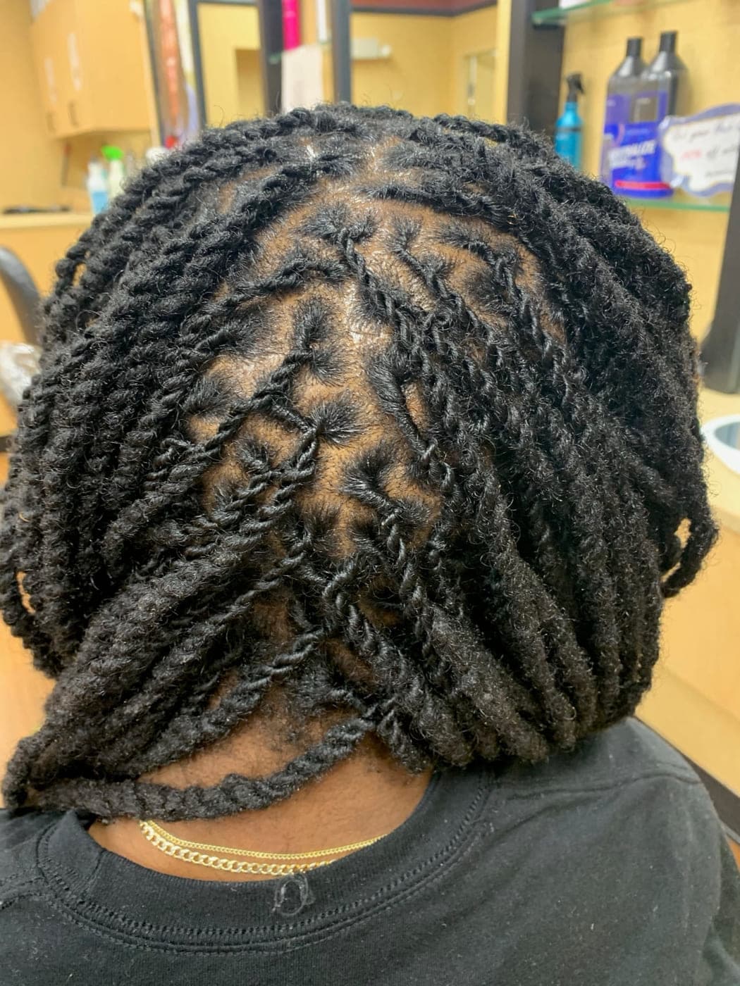 Completed Microloc installation showing clean parting and finished locs